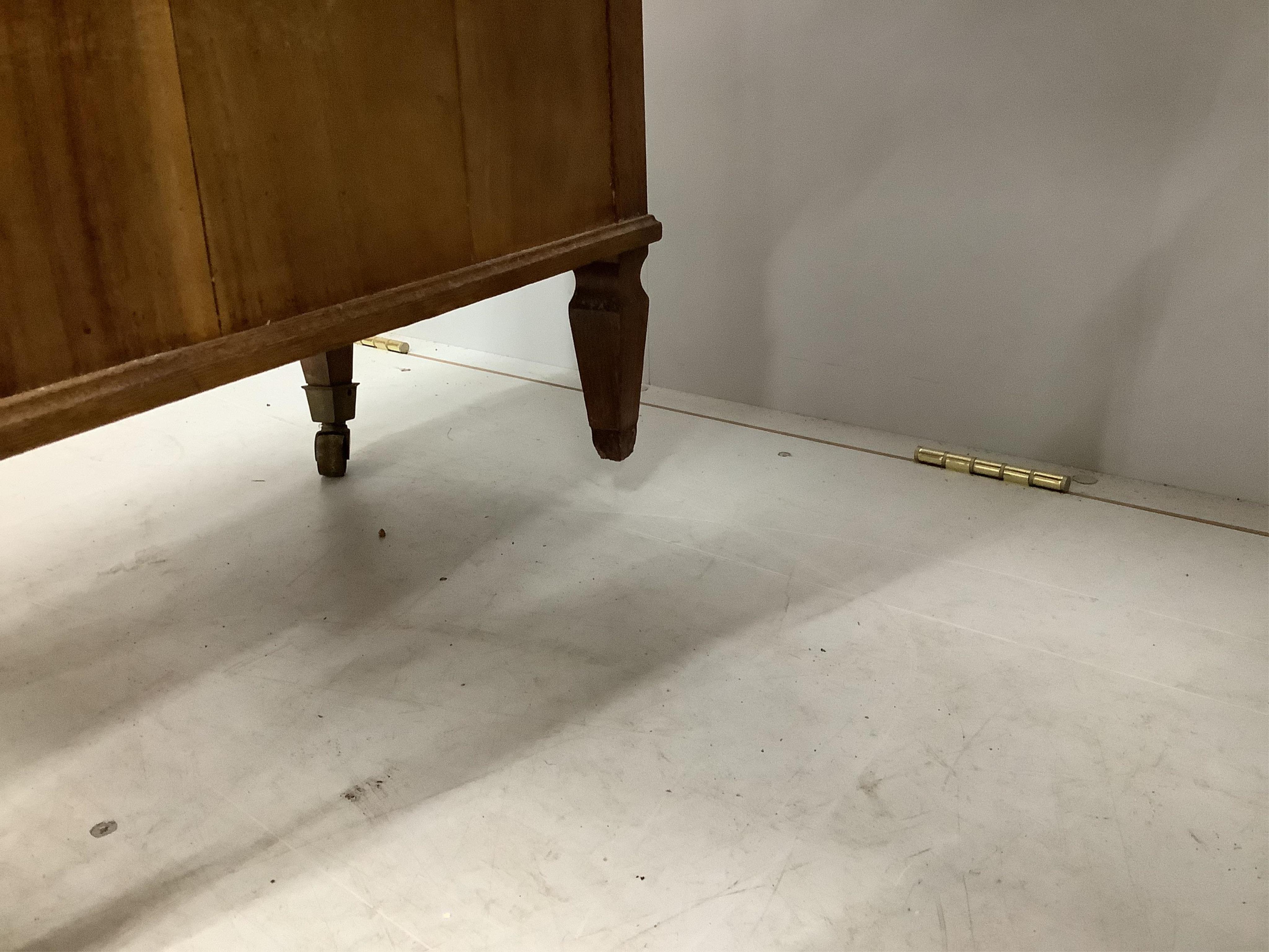 A late Victorian walnut nine drawer kneehole desk, missing two castors and one handle, width 112cm, depth 59cm, height 78cm